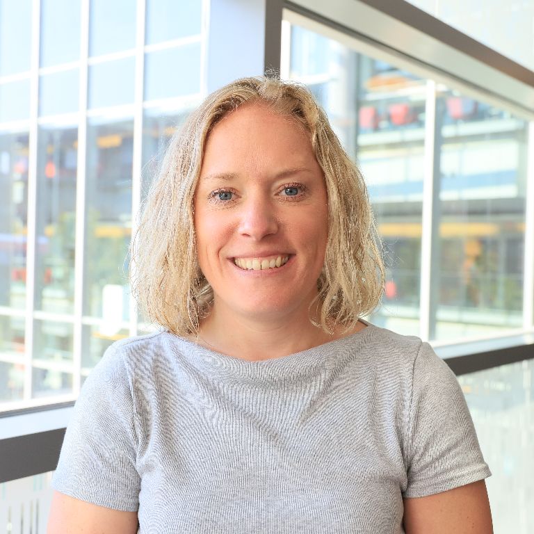 A headshot of Alex Nixon